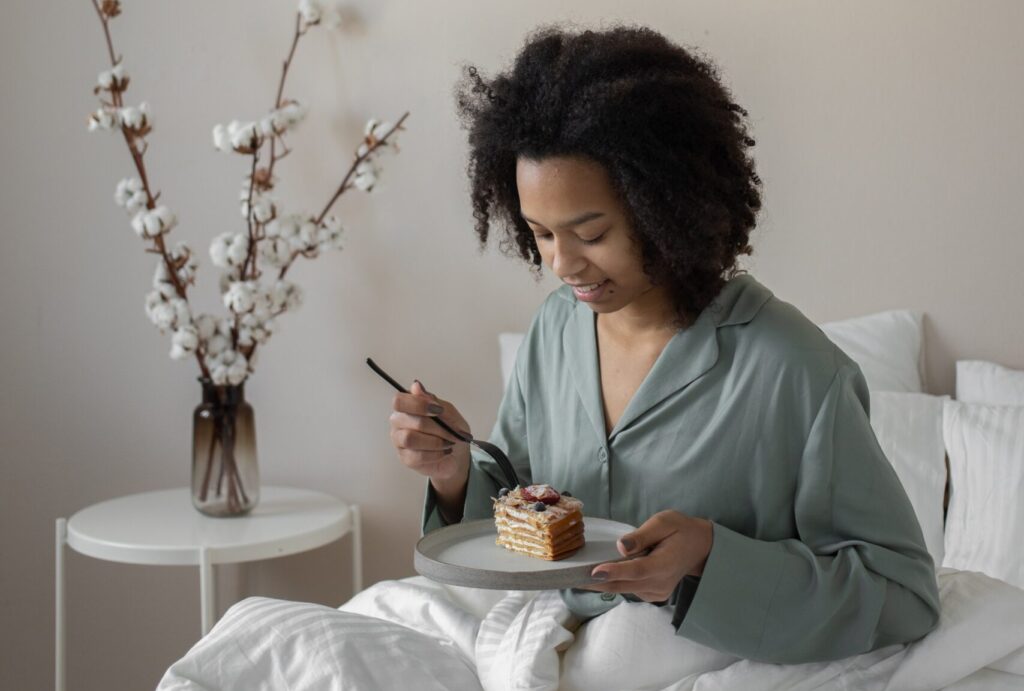 Women eating in bed