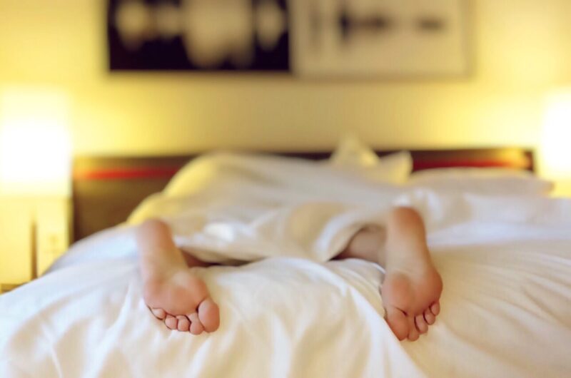 feet sticking out of bed