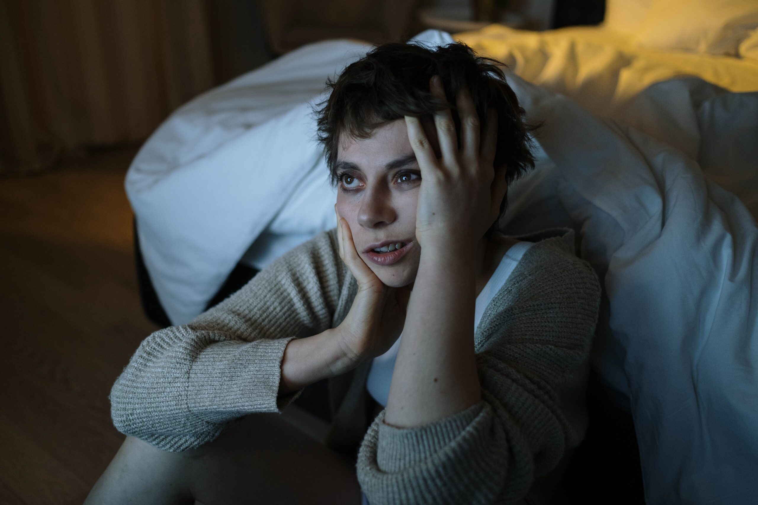 Anxious person in bed